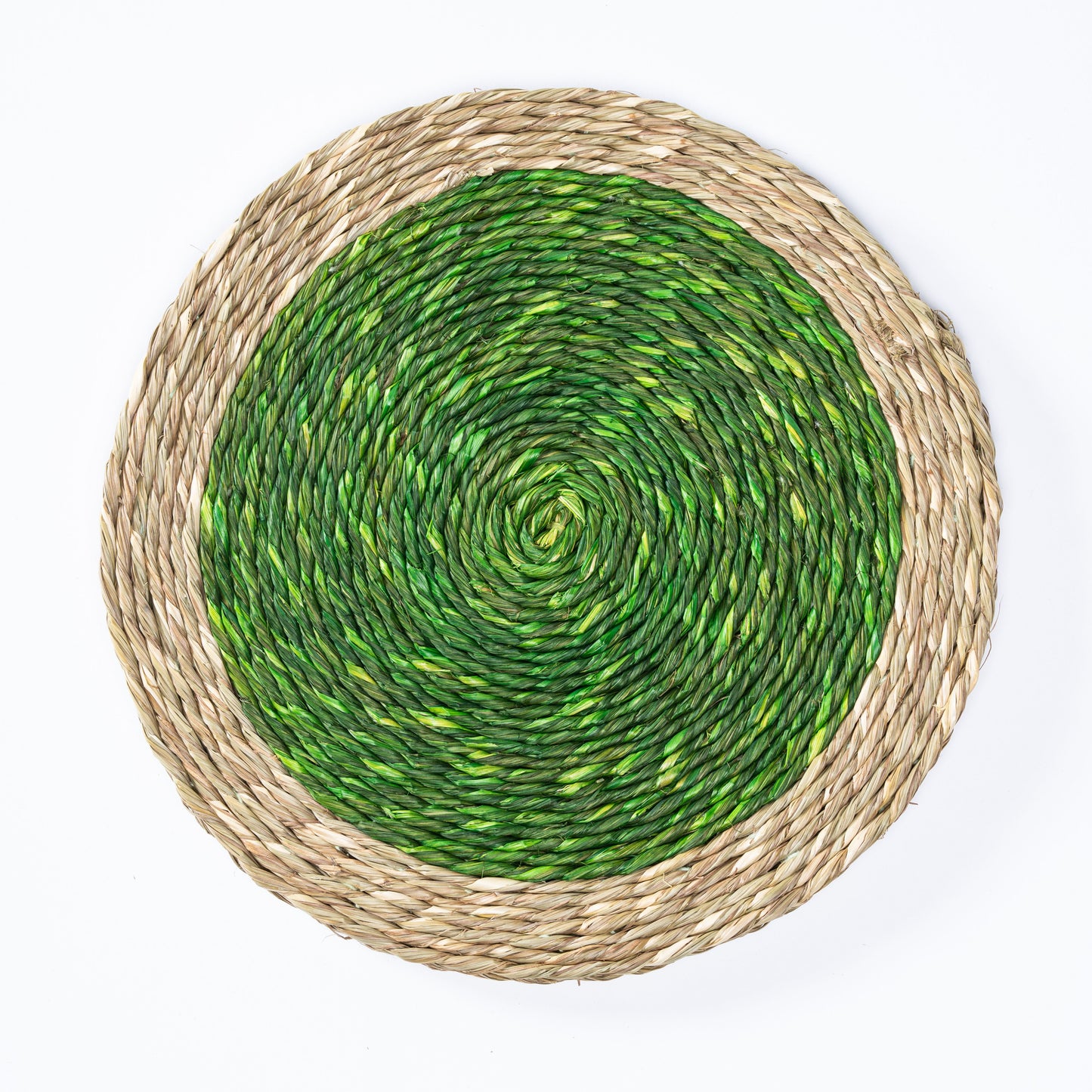 Top view of a handwoven green and natural Sabai grass plate mat