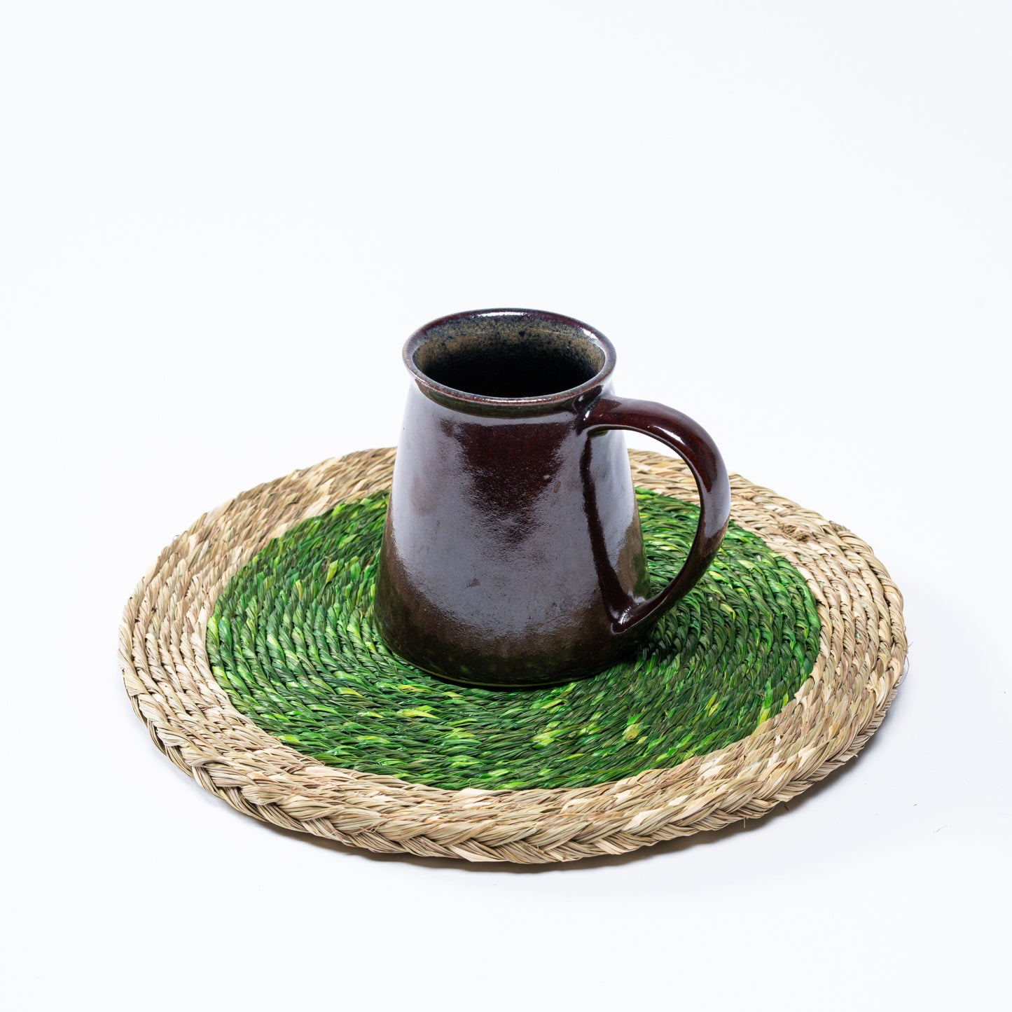 Sabai grass plate mat in use with a ceramic mug