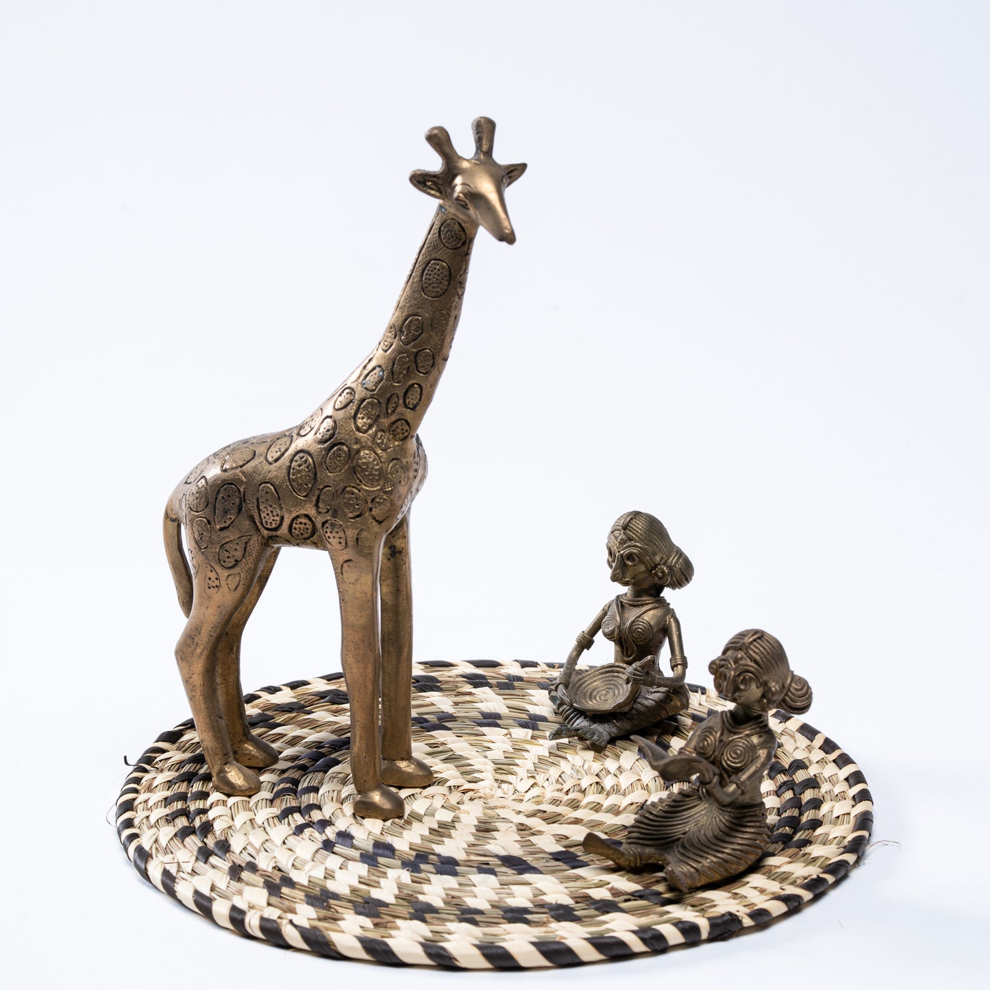 Black and white Sabai mat used as decor tray with figurines