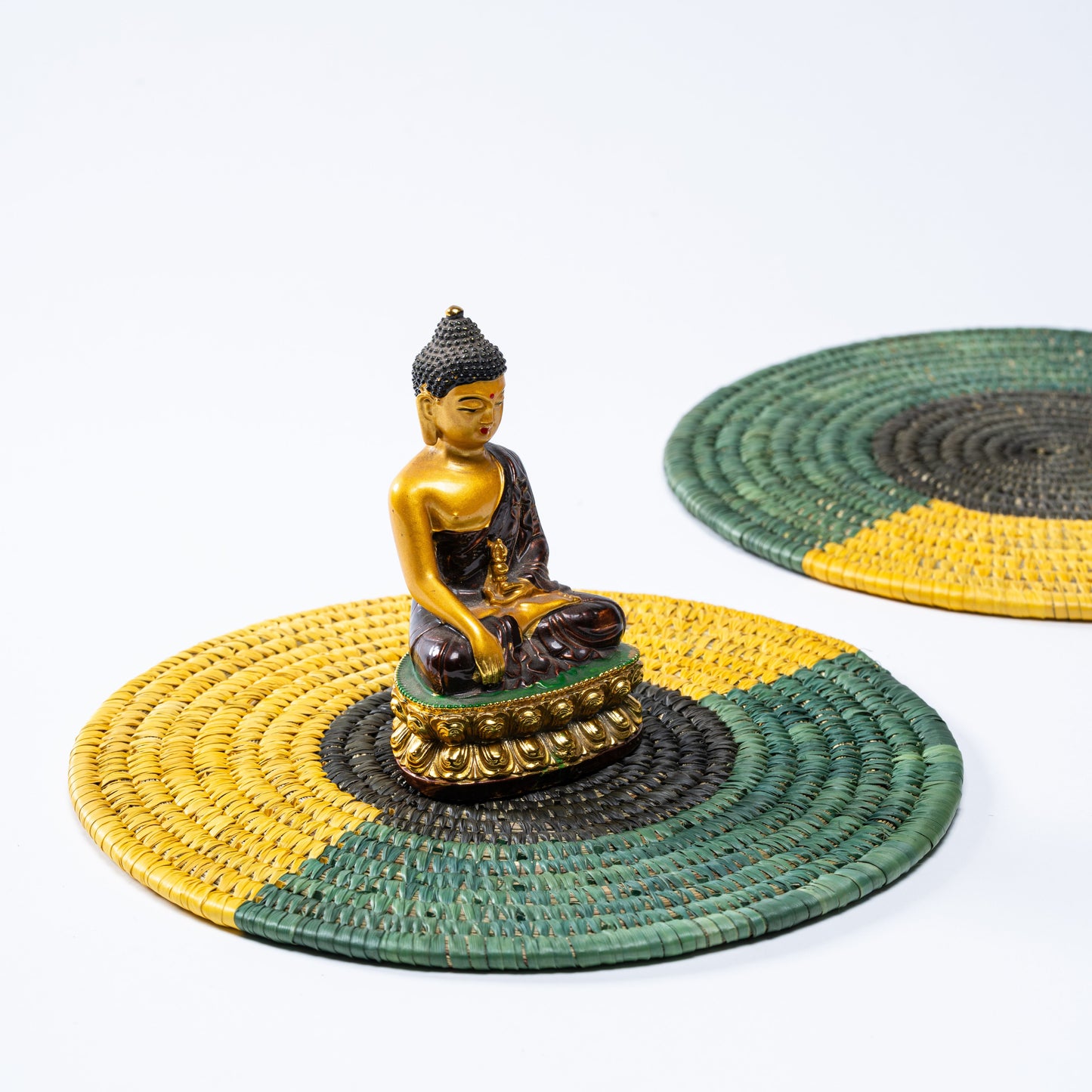 Pair of Tricolour Sabai Plate Mats styled with ceramic bowls for table setting.