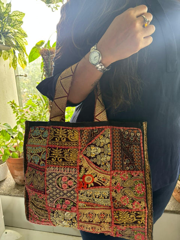 Recycled antique embroidered patchwork bag carried on the shoulder