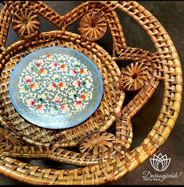 Hand-painted floral plate on a decorative sabai grass basket tray