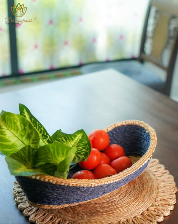 Tomatoes and fresh greens in an indigo sabai grass fruit basket
