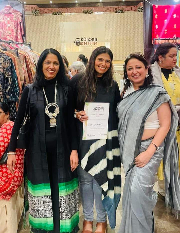 Daroonjinish team with an award certificate at the Kolkata Kettle exhibition