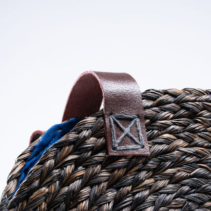 Close-up of the leather handle and stitching details on the Dokra Sabai Joda Bag