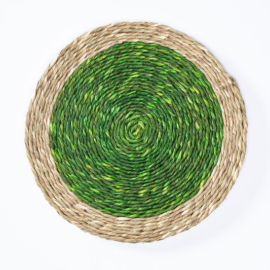 Top view of a handwoven green and natural Sabai grass plate mat
