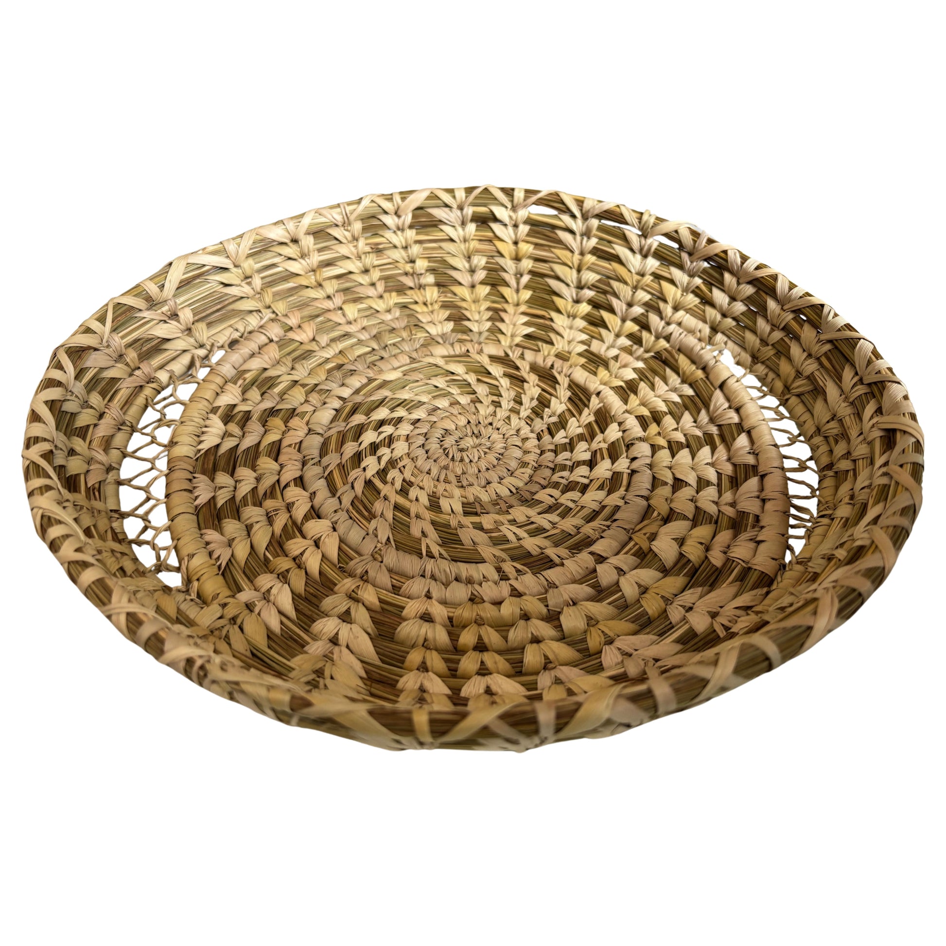 Indigo handwoven basket used to hold fresh oranges, styled on a kitchen table.