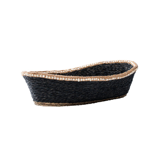 Handwoven sabai boat basket in black with pearl bead trim – angled side view

