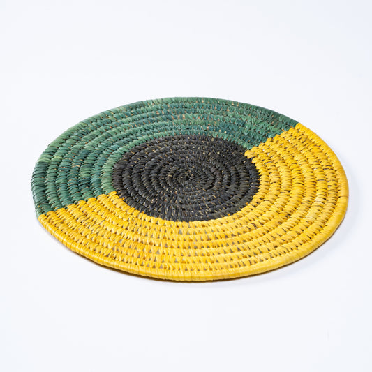 Top view of Tricolour Sabai Plate Mat handwoven in green, black, and yellow.