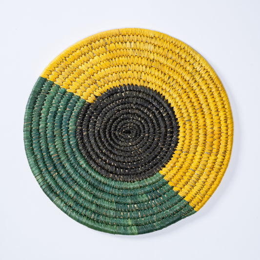 Top view of Tricolour Sabai Plate Mat handwoven in green, black, and yellow.